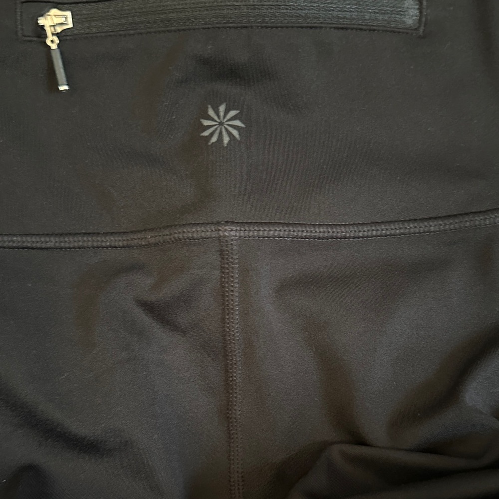 Black Athleta leggings. Reflective bottom, GUC Small with 25’ inseam